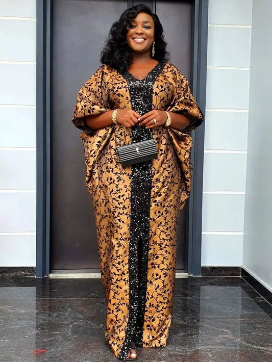 Woman in a leopard print outfit with a black and gold dress, standing indoors.